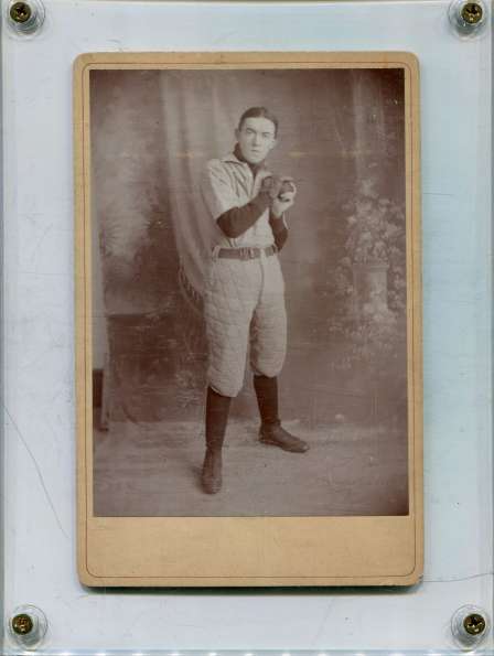 Early Base Ball Player with N on Jersey with a Glove and Ball Studio Portrait