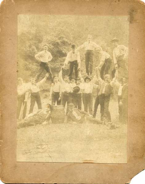 Early Base Ball Players Standing on Shoulders with Bats and a Barrel