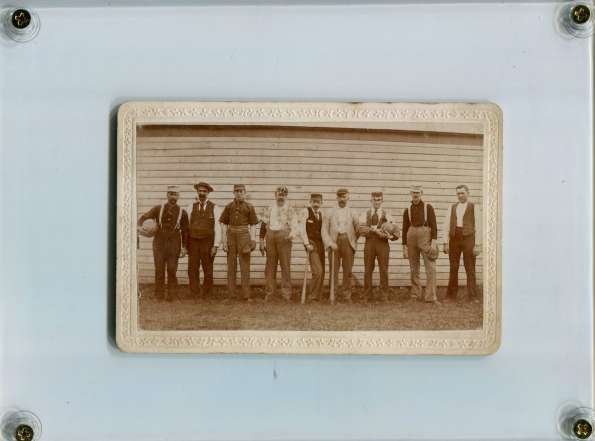 Early Base Ball Team in Front of Wall with Gloves ad Bats