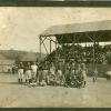 Early Base Ball Team with Suspenders on Uniforms on Field in Front of Stands 1896